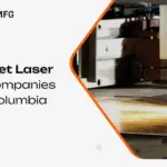 Sheet laser cutting machine cutting a steel sheet with sparks at a British Columbia metal fabrication shop